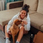 Sarah Wilson with Dog Woman Feeding Dog
